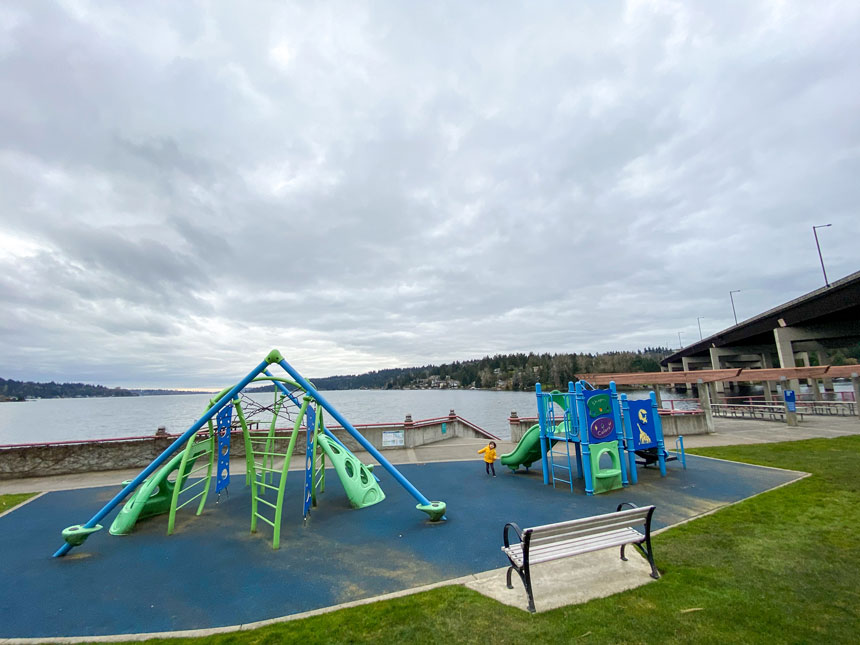 Enatai Beach Park Playground, toddler girl playing on this small but charming waterfront playground in Bellevue