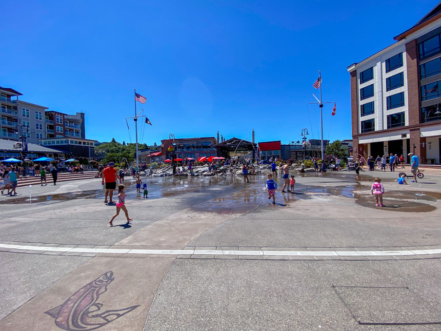 The summer splash pad at Point Ruston Waterfront is a free and fun-filled activity that’s perfect for families visiting Tacoma. With water jets shooting up from the ground, kids can cool off and play safely while parents relax nearby with views of the Puget Sound. Located along the scenic, car-free waterfront promenade, this splash pad is just steps from family-friendly dining, the waterfront playground, and ice cream shops. It’s an ideal stop to include on any Seattle family vacation itinerary—especially when combined with a visit to nearby Point Defiance Park for a full day of outdoor adventure and kid-approved fun