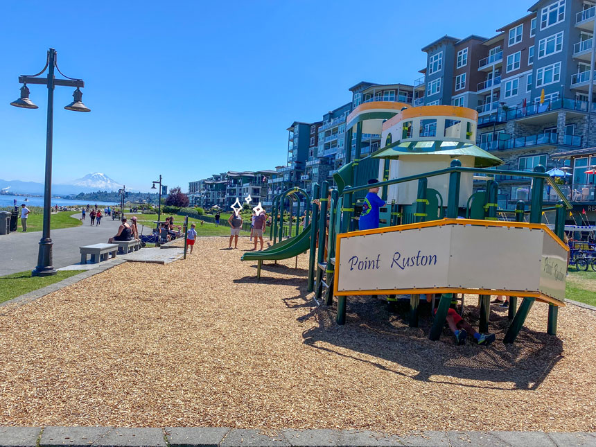 The Point Ruston Waterfront Playground, shaped like a boat, is a popular spot for families with young kids. Set along the scenic waterfront, this small playground features fun climbing structures, swings, and plenty of space to play while parents enjoy the Puget Sound views. Its unique design and location make it a favorite stop along the Point Ruston paved walkway.