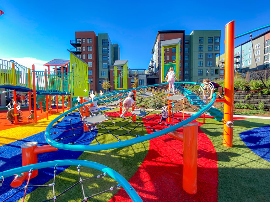 Kids playing and climbing at Totem Lake playground