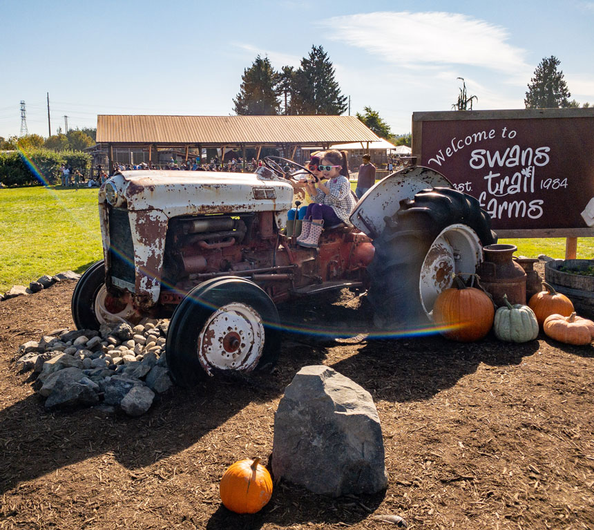 Swans Trail Farms Fall Festival Kids Taking Photos on the Tractor Display
