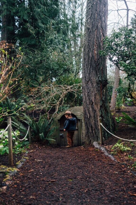 A small boy finds his home. Hobbit door at Bellevue Botanical Garden