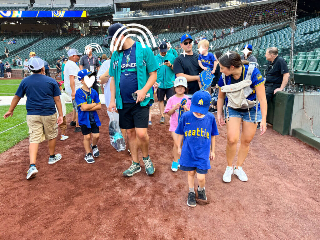 Mariners Baseball game Seattle, Kids Run Around The Bases line up on the field