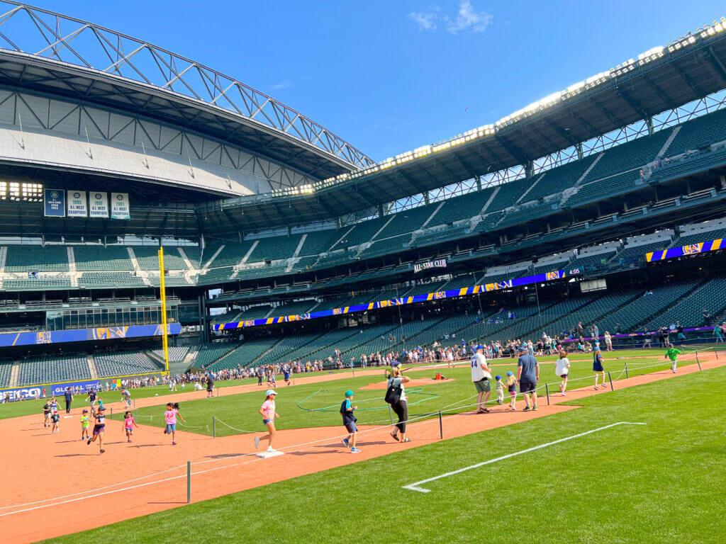 Mariners Baseball game Seattle, Kids Run Around The Bases, photo from third base, very young kids can run with their parents