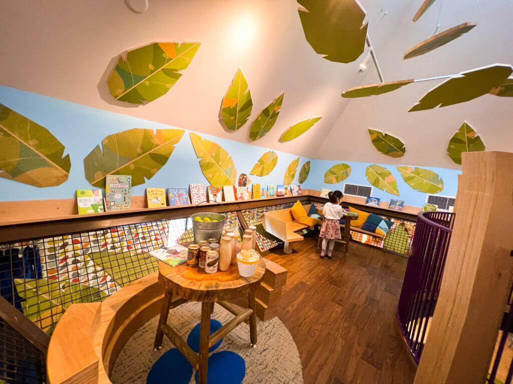 The Story Tree at KidsQuest Children’s Museum in Bellevue is a magical, climbable centerpiece filled with books, woodland animals, and cozy reading nooks. Designed to spark imagination and a love of storytelling, this whimsical tree invites kids to curl up with a book, discover hidden animal figures, or climb into its inviting branches for a quiet moment of exploration. It’s a peaceful yet interactive exhibit that blends literacy, nature, and play—perfect for kids of all ages
