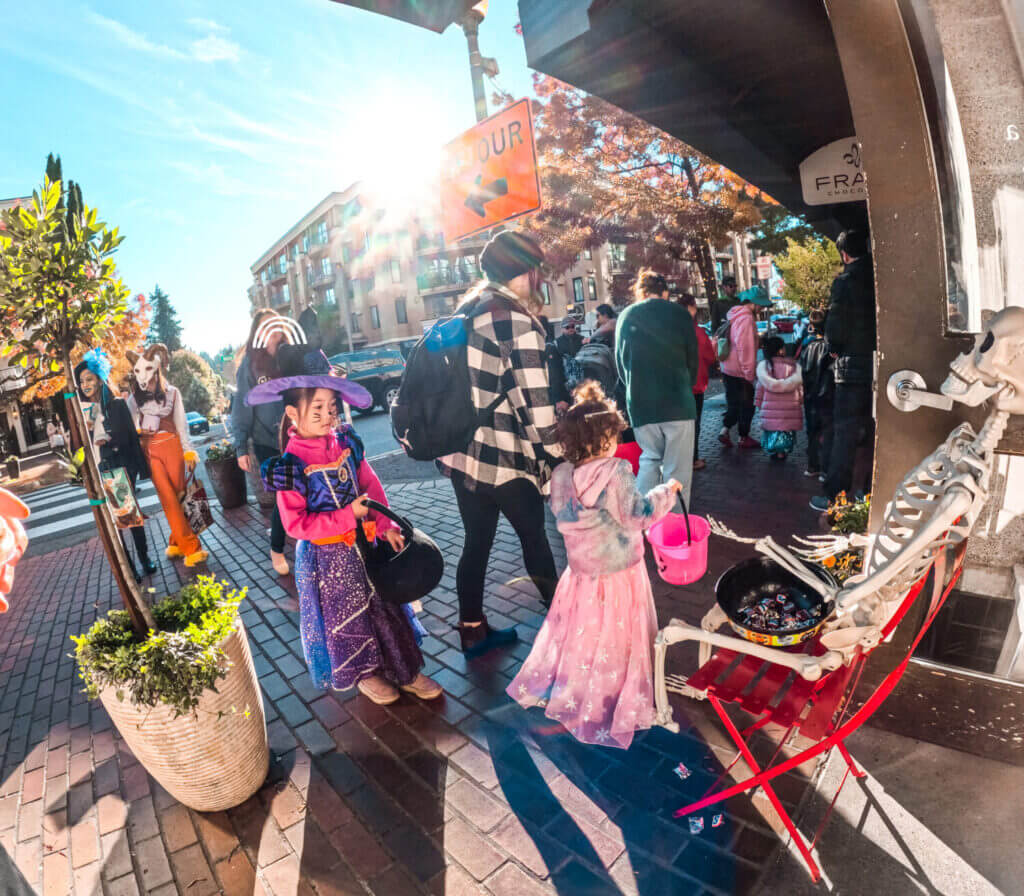 Girls Trick or Treating at Old Bellevue on Main Street for Halloween from the participating shops.