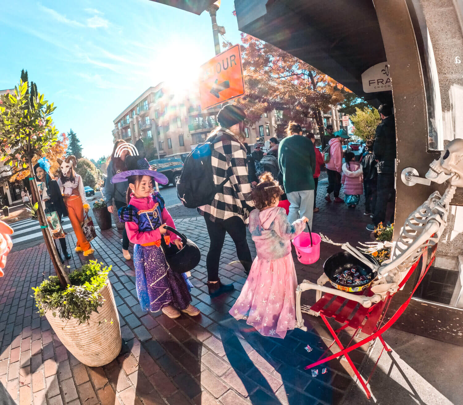 Girls Trick or Treating at Old Bellevue on Main Street for Halloween from the participating shops.