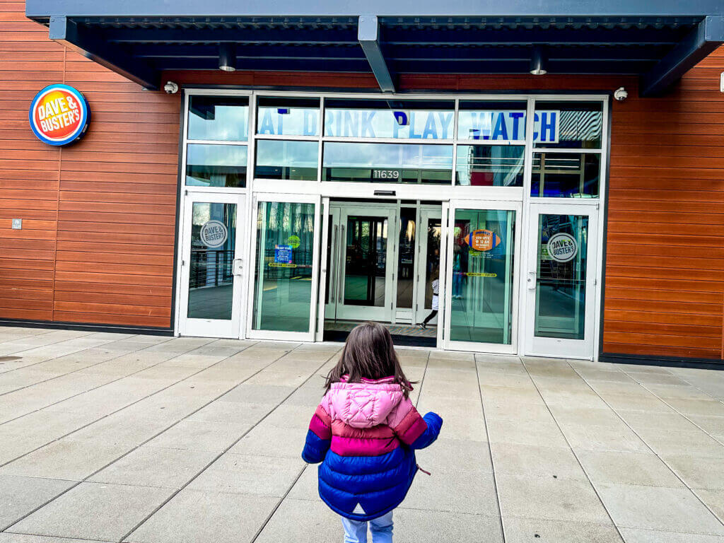 Toddler Girl Walking into Bellevue Dave and Busters Entry