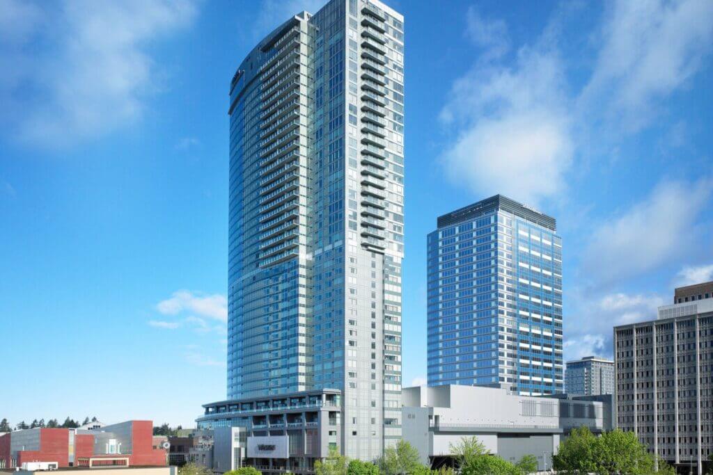 The Westin Bellevue in downtown Bellevue, showcasing the tall hotel tower on a sunny day. This modern and family-friendly hotel is located just steps away from Bellevue Downtown Park, making it one of the best places to stay with kids near Seattle.
