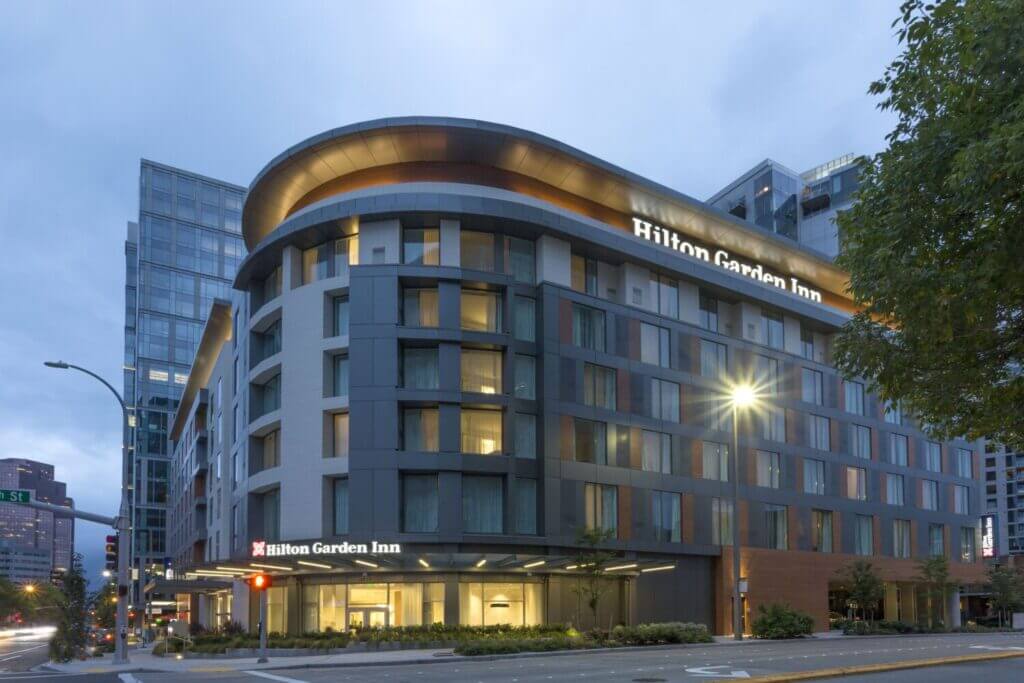 Exterior of Hilton Garden Inn Bellevue, a modern and welcoming hotel for families visiting the Seattle area. Conveniently located near shops and parks, this hotel offers comfort, value, and easy access to top family attractions.