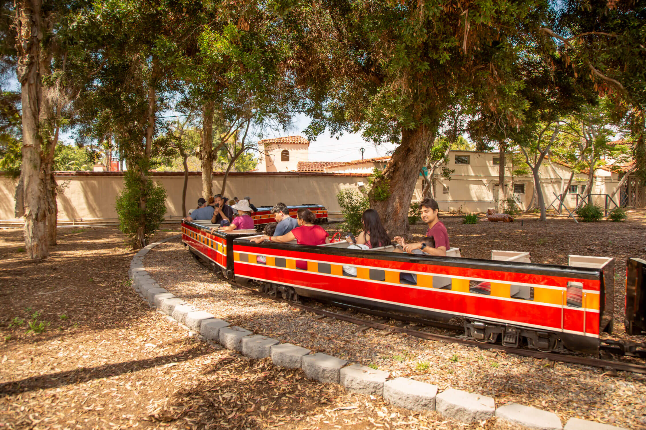 A kid-friendly activity at Balboa Park, the Miniature Railroad offers a fun train ride through a scenic half-mile loop. Families can enjoy this classic attraction as kids experience the joy of riding on a real miniature train, passing through trees and open park areas.