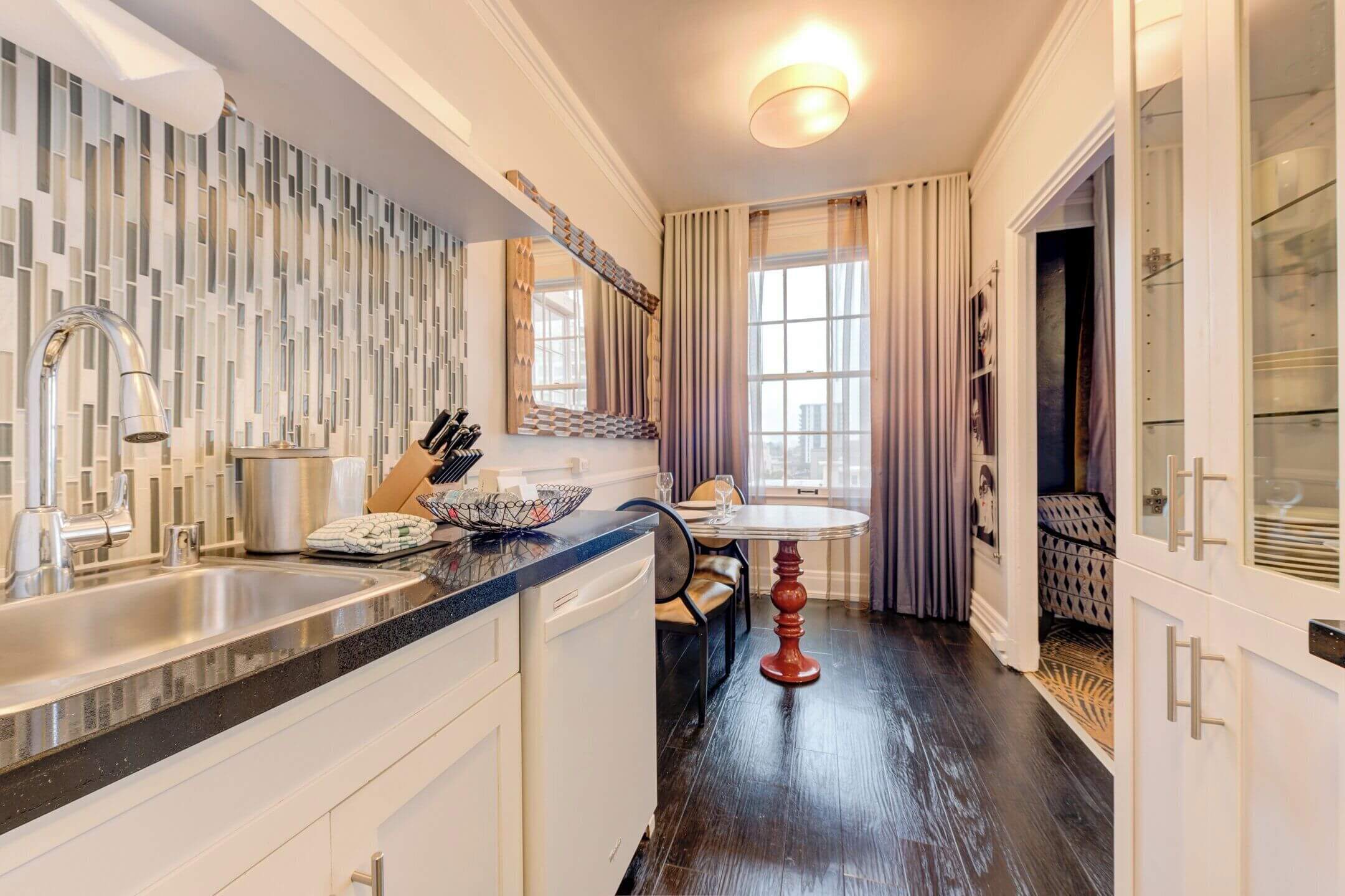 Inn at the Park, a charming boutique hotel near Balboa Park in San Diego, featuring a spacious 1-bedroom suite with a private kitchenette. The suite includes a fridge, microwave, stovetop, and dishwasher, making it a great choice for families or extended stays. With its historic charm and prime location near museums, the San Diego Zoo, and Balboa Park attractions, this hotel offers both comfort and convenience for visitors.