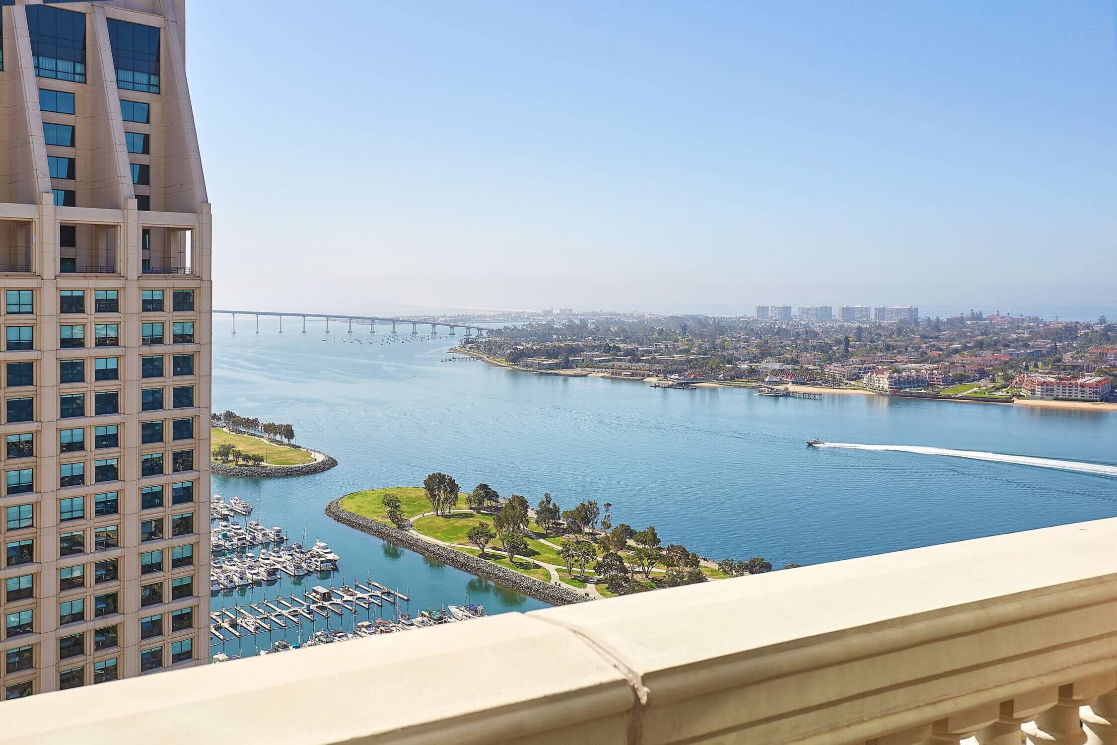 Amazing bayfront view from Manchester Grand Hyatt San Diego, a kid-friendly hotel located in the heart of downtown Gaslamp Quarter. This luxury high-rise hotel offers stunning panoramic views of San Diego Bay, spacious family-friendly accommodations, and easy access to top attractions like Seaport Village, USS Midway Museum, and Petco Park. A great choice for families looking for both comfort and convenience while exploring San Diego.