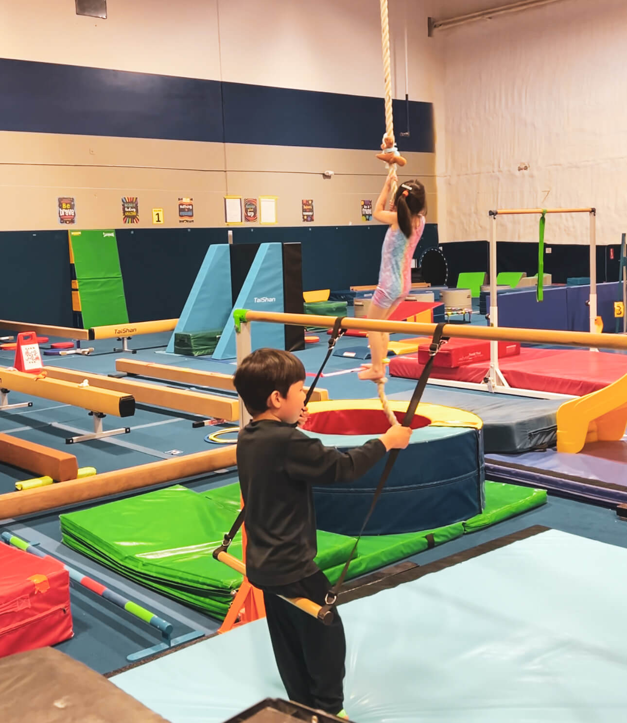 Gymnastics Connection summer camp is packed with engaging obstacle courses, tumbling mats, balance beams, and bars—designed to keep kids moving, learning, and having a blast all summer long. The gym transforms into an exciting play and training space where campers are guided through a variety of age-appropriate challenges that promote strength, flexibility, coordination, and confidence. With fun circuits and activities that change daily, kids stay motivated and entertained while developing important physical and social skills. Whether they’re swinging on bars, hopping through hurdles, or learning beginner routines, Gymnastics Connection offers a dynamic and supportive environment for young gymnasts of all skill levels.