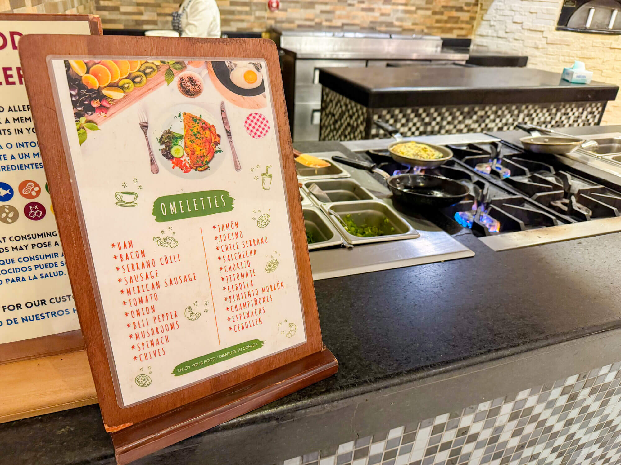 Custom omelets sizzling on the grill at the Dreams Vallarta Bay Resort breakfast buffet, where guests can choose from a wide variety of fresh toppings including cheese, veggies, ham, and more. The breakfast spread is generous and kid-friendly, featuring everything from pancakes and waffles to tropical fruit, fresh pastries, yogurts, and juices. There’s even a smoothie bar and rotating hot dishes like chilaquiles and breakfast burritos for a local touch. With ocean views and attentive service, it’s the perfect way for families to fuel up before a day of poolside fun or exploring Puerto Vallarta