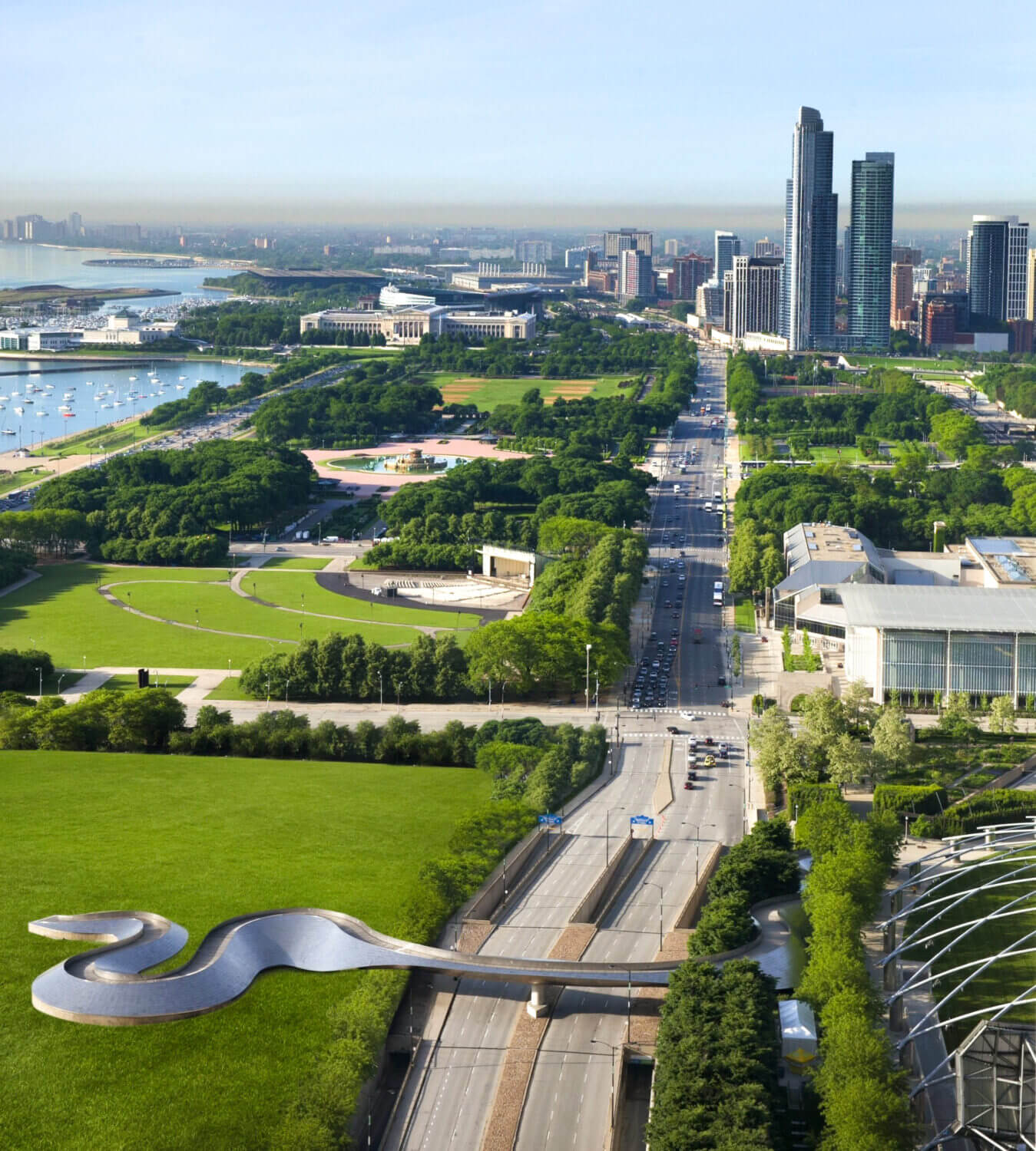 Scenic view from a guest room at the Fairmont Chicago overlooking Millennium Park, with sights of green park spaces, the city skyline, and iconic Chicago landmarks.