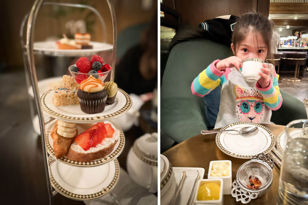 Young girl enjoying afternoon tea at the Fairmont Olympic Hotel in downtown Seattle, sipping from a teacup with a three-tiered tray of treats in front of her. This family-friendly tradition makes the Fairmont one of the best places to stay with kids in downtown Seattle.