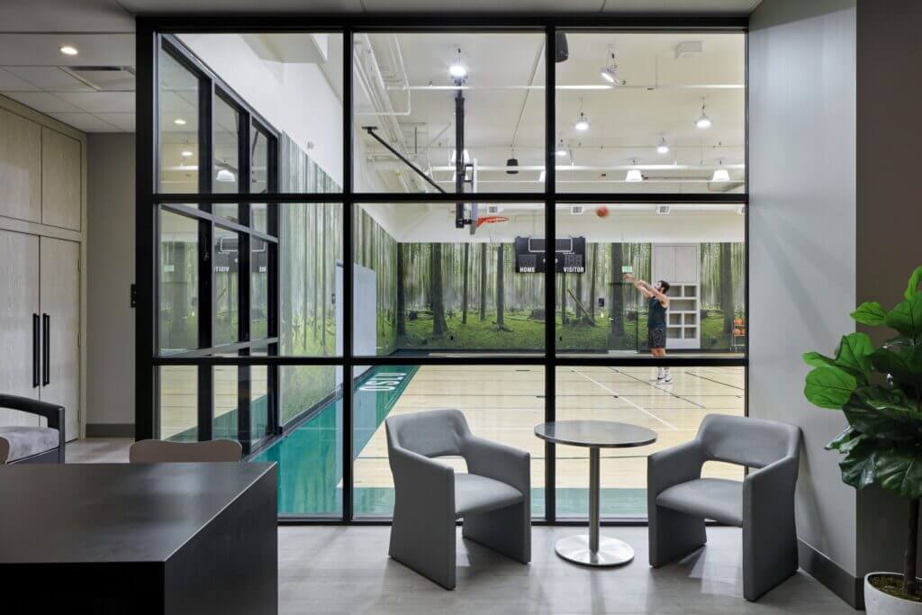Indoor basketball court at Level Seattle Downtown in South Lake Union, a unique family-friendly hotel feature where kids and adults can shoot hoops and stay active during their stay.