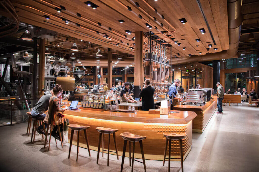 Inside the Starbucks Reserve Roastery in Seattle’s Capitol Hill neighborhood, featuring immersive coffee experiences, coffee roasting equipment, and a spacious, stylish interior where families can watch beans being roasted and try unique drinks and treats.